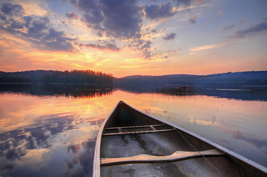 bow-of-canoe-on-lake-at-sunset-matt-champlin