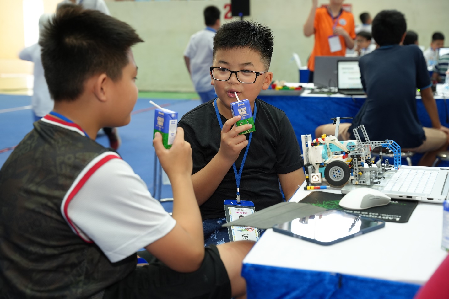 A group of young boys at a table  Description automatically generated