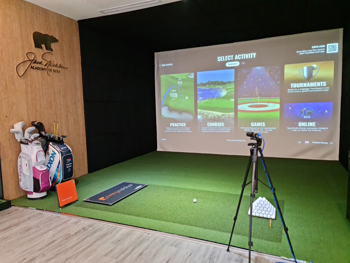 A golf club with a projector screen  Description automatically generated