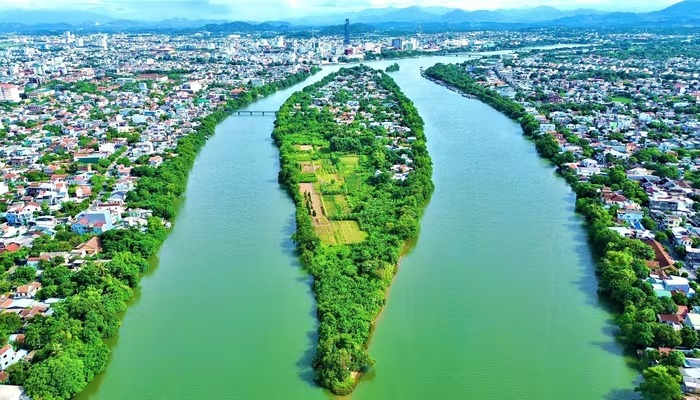 Cây cầu 2.000 tỷ bắc qua dòng sông biểu tượng tại TP trẻ nhất Việt Nam có chuyển động mới- Ảnh 1.