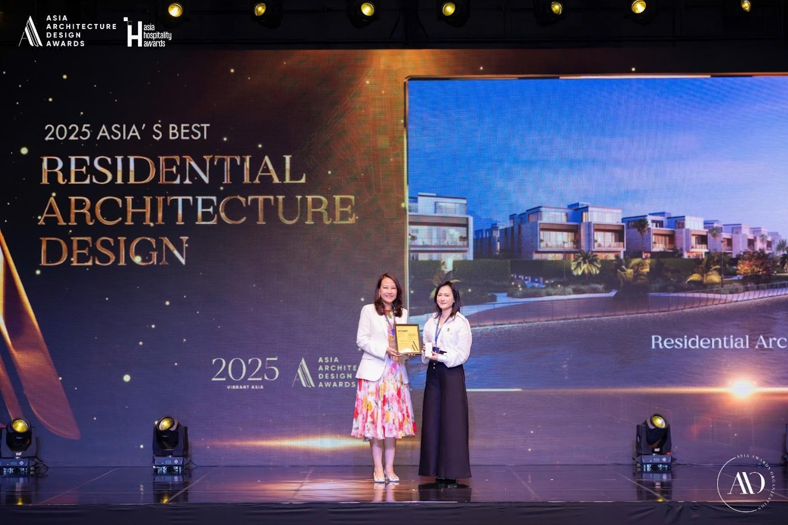 Two women on a stage  AI-generated content may be incorrect.