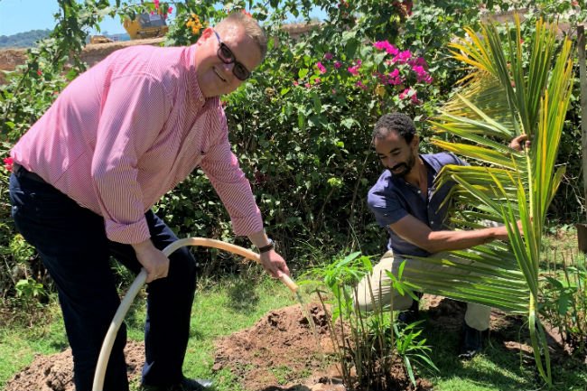 The resort’s general manager Marko Janssen waters a bamboo bush on the farm. (Photo: Courtesy of Radisson Blu Resort Phu Quoc)