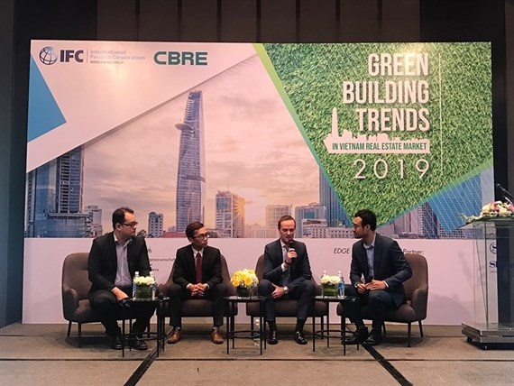 A panel discussion at a conference on green building in HCM City where experts stressed the benefits of adopting such standards. (Photo: VNA)