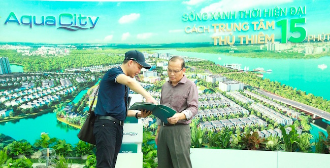 A man takes a look at the Aqua City project during the expo.