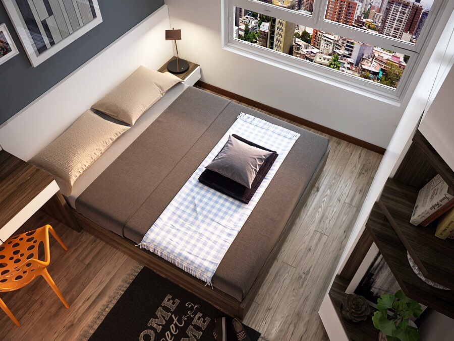 Bàn làm việc và giường ngủ dùng tông màu nâu trắng đồng điệu với màu nền gỗ khiến căn phòng trở nên rộng rãi 