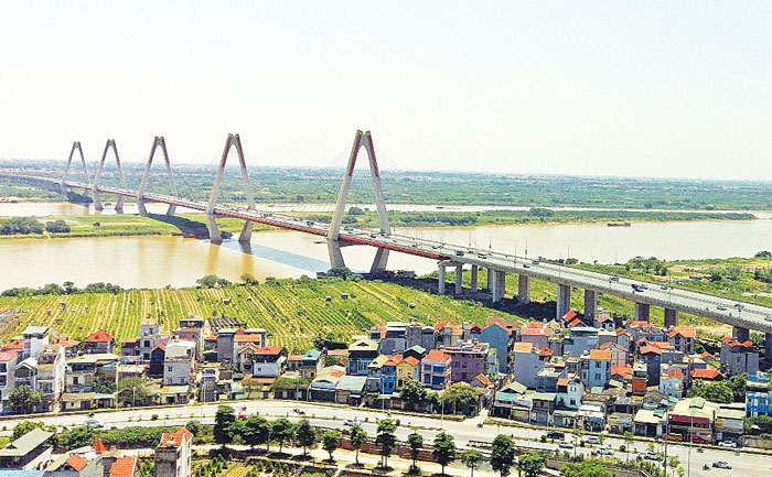 Phía Bắc sông Hồng bao gồm Mê Linh – Đông Anh – Long Biên là khu vực chủ yếu phát triển mới, hình thành các khu đô thị mới đồng bộ hiện đại. Ảnh: Nguyễn Linh