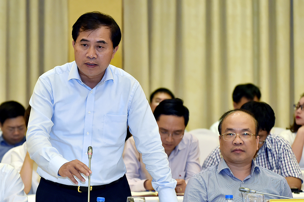 Thứ trưởng Bộ Xây dựng Lê Quang Hùng trả lời báo chí.