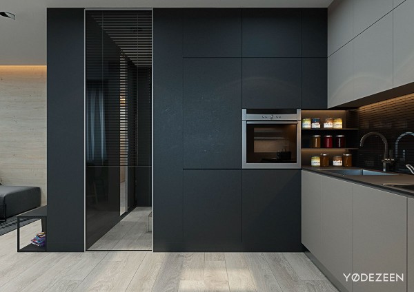 Nhà bếp được thiết kế đặc biệt tối giản với bức vách đen lì và bộ tủ bếp màu beige.