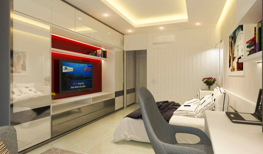 Phòng ngủ của chủ nhà với tông màu hiện đại: trắng, xám, đỏ. Không gian nội thất phòng ngủ của căn hộ chung cư 60m2 này được thiết kế một cách tối giản, không có bất cứ một chi tiết thừa, tập trung vào công năng nghỉ ngơi của chủ nhân ngôi nhà…Ảnh: Viphouse