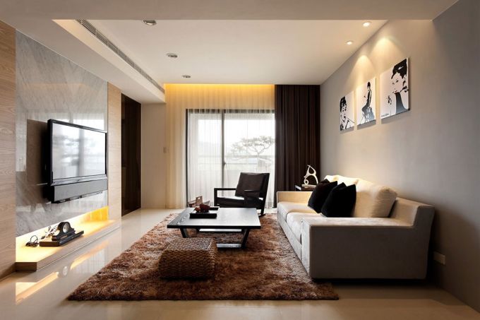 Các đồ nội thất phòng khách để trang trí được sử dụng rất đơn giản chỉ với 3 bức tranh đen trắng
