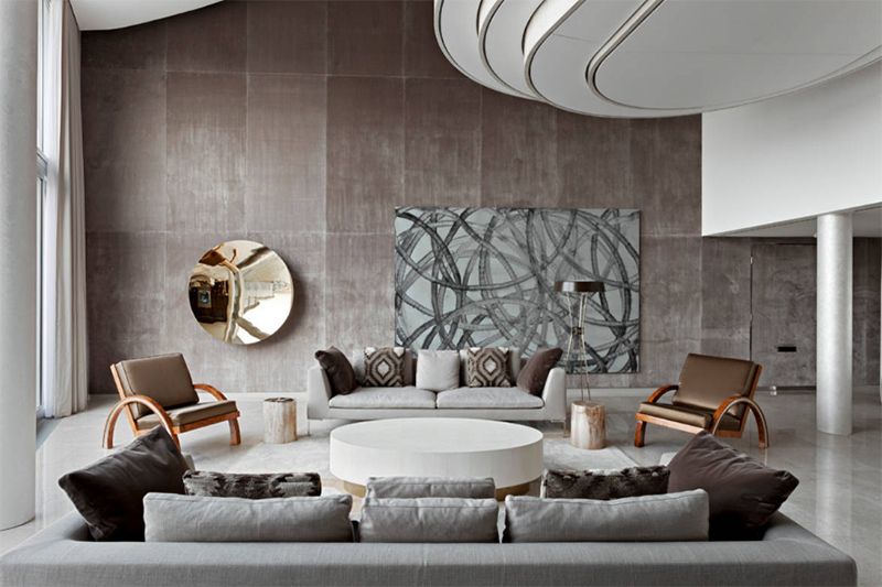 Màu sắc tốt nhất để kết nối những đồ nội thất phòng khách có màu xám và nâu lại với nhau là sử dụng màu trắng để kết nối