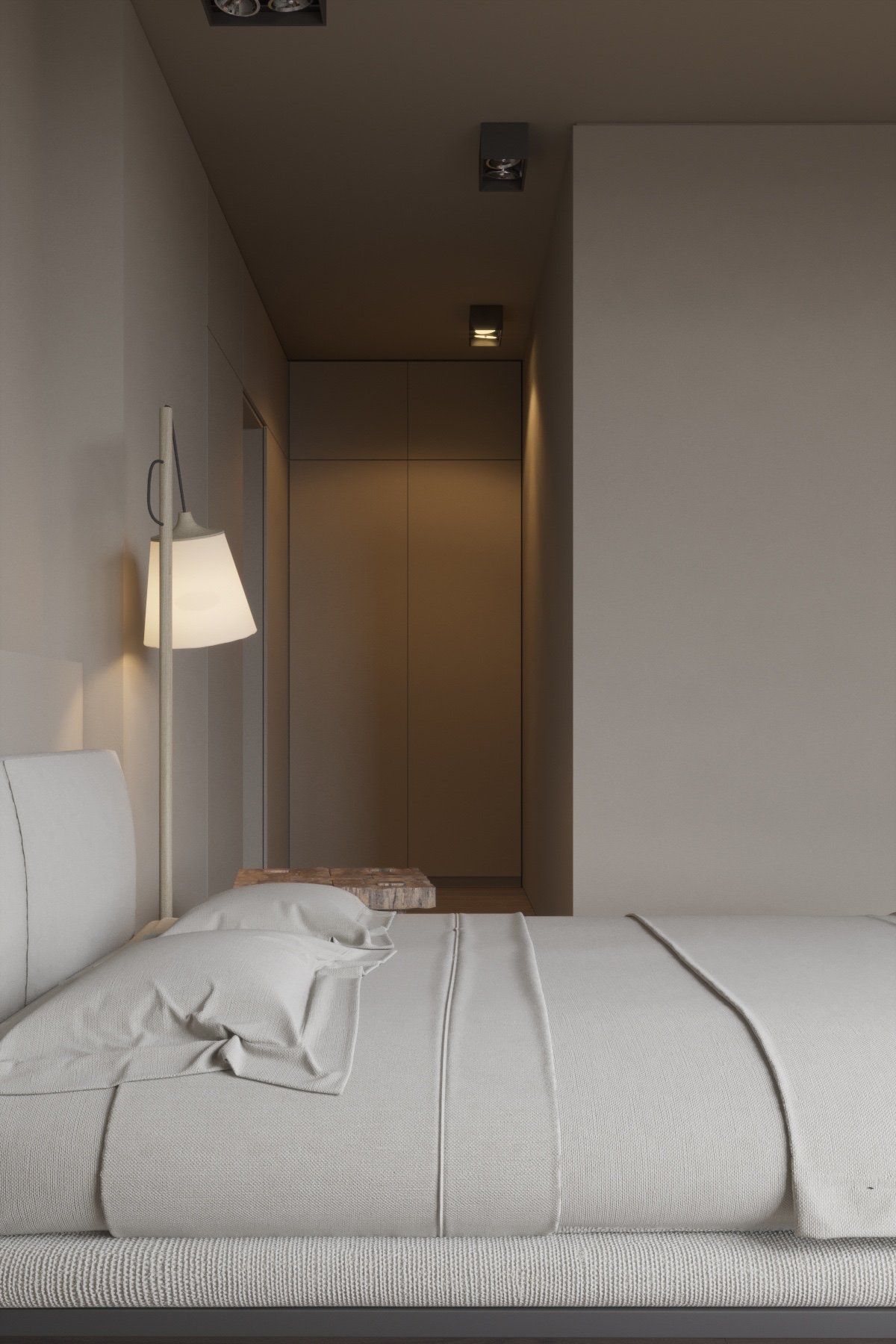 Một chiếc giường ga trắng giản đơn ở trung tâm hòa quyện với màu sắc của những bức tường.