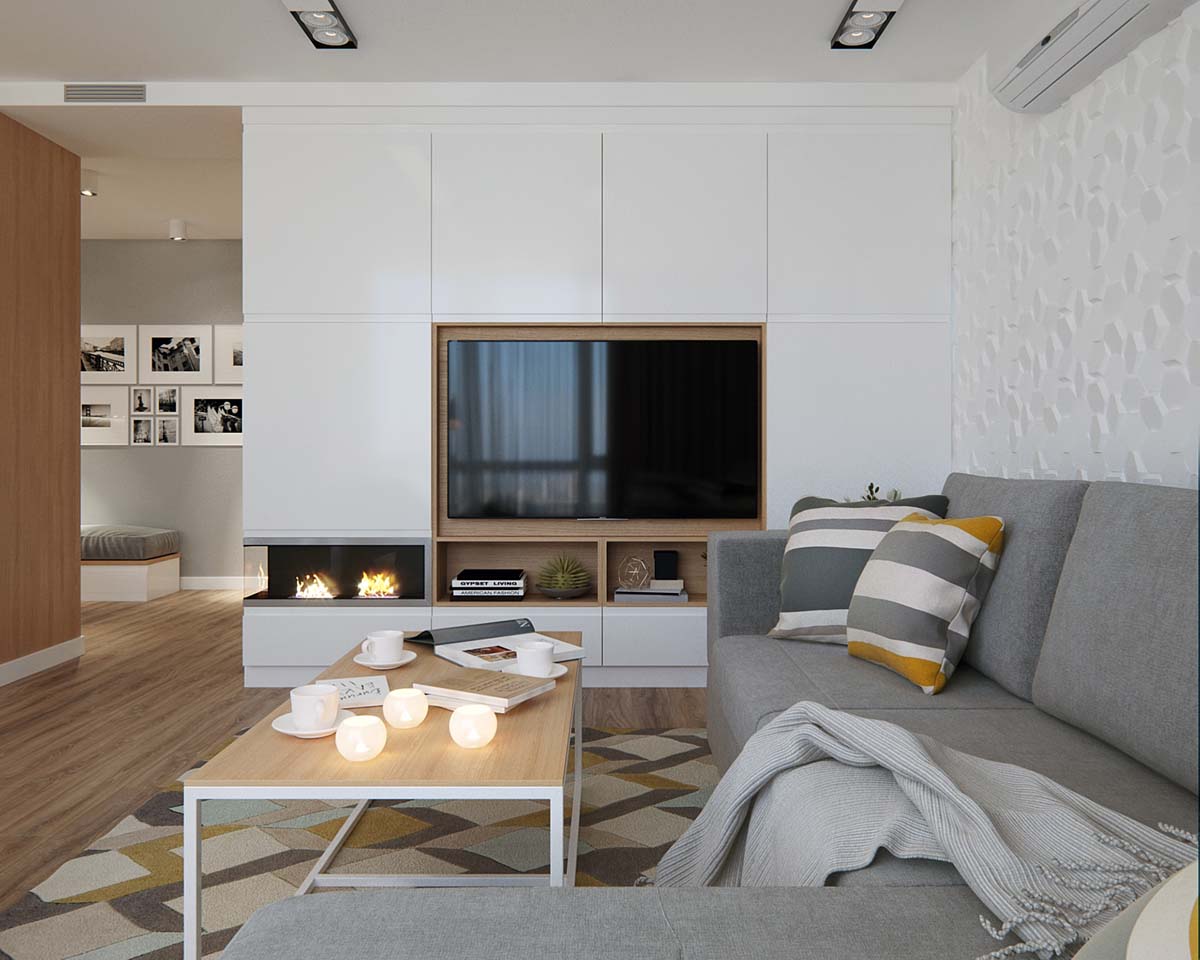 Ngoài ra, khi thiết kế nội thất căn hộ còn có một số bí quyết khác có thể áp dụng như đặt đồ đạc âm vào tường cũng tạo ra nhiều không gian hơn. Chiếc tivi này là một ví dụ.