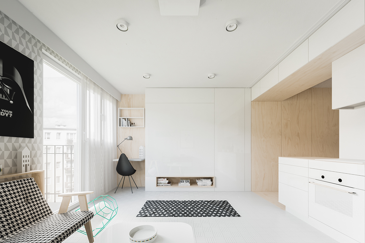 Những bộ tủ, kệ màu trắng kết hợp thảm và salon trắng - đen cũng đủ để tạo ra điểm nhấn cho căn nhà.