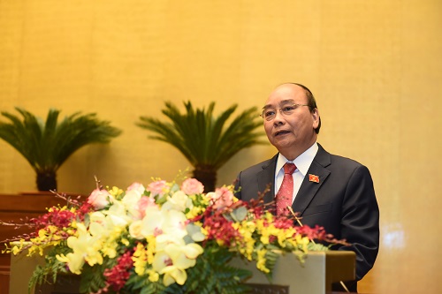 Thủ tướng Nguyễn Xuân Phúc trình bày báo cáo tại Quốc hội