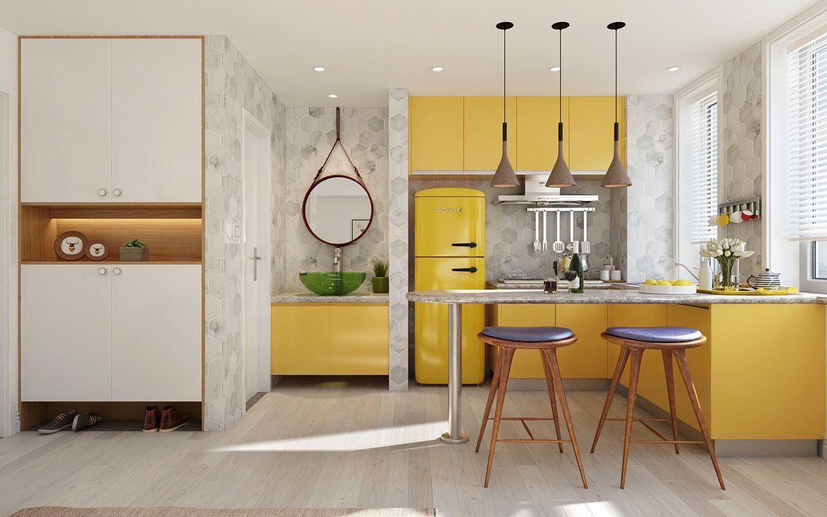 Màu vàng cúc vạn thọ luôn mang đến vẻ ấm cúng, gần gũi cho không gian nấu nướng. Tuy vậy, bạn chỉ nên sử dụng gam màu này cho bức tường điểm nhấn hoặc tủ bếp, bàn đảo, bàn ăn...