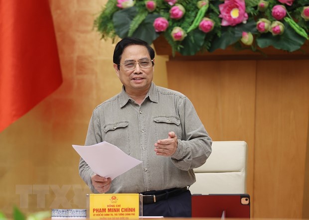 Thủ tướng Phạm Minh Chính chỉ đạo công tác phòng, chống dịch COVID-19. (Ảnh: Dương Giang/TTXVN)
